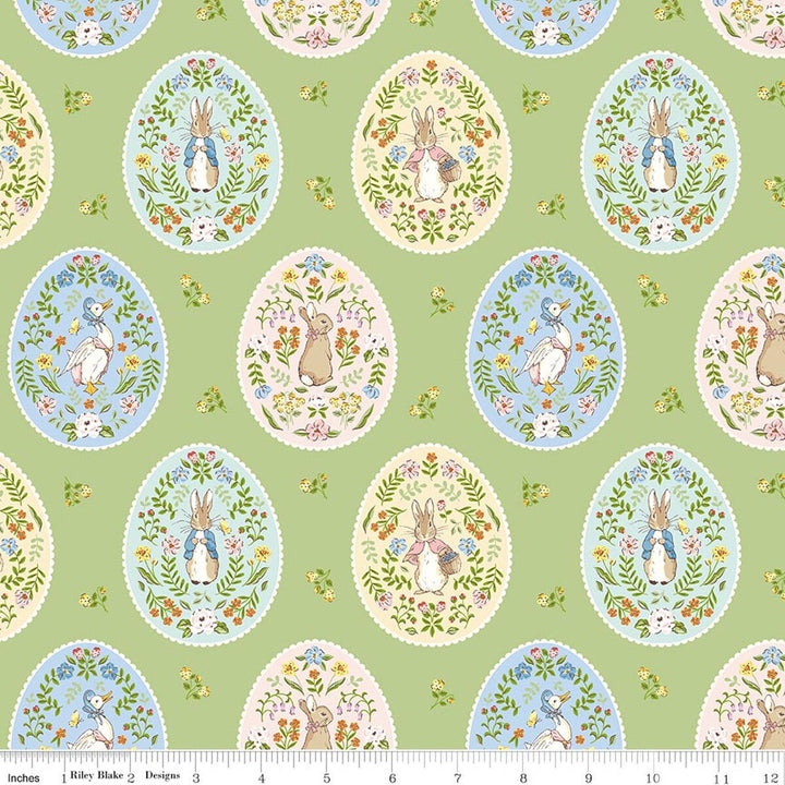 Patterned fabric with Easter-themed designs on a green background