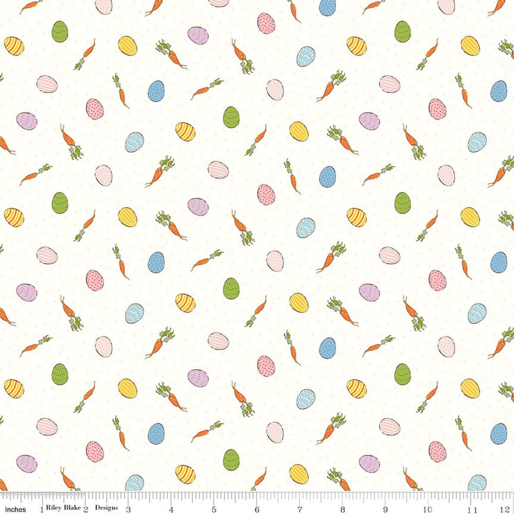 Pattern of Easter eggs, carrots, and flowers on a white background