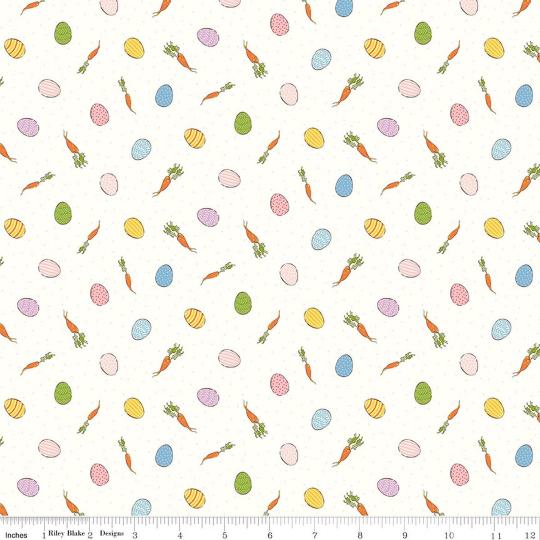 Pattern of Easter eggs, carrots, and flowers on a white background