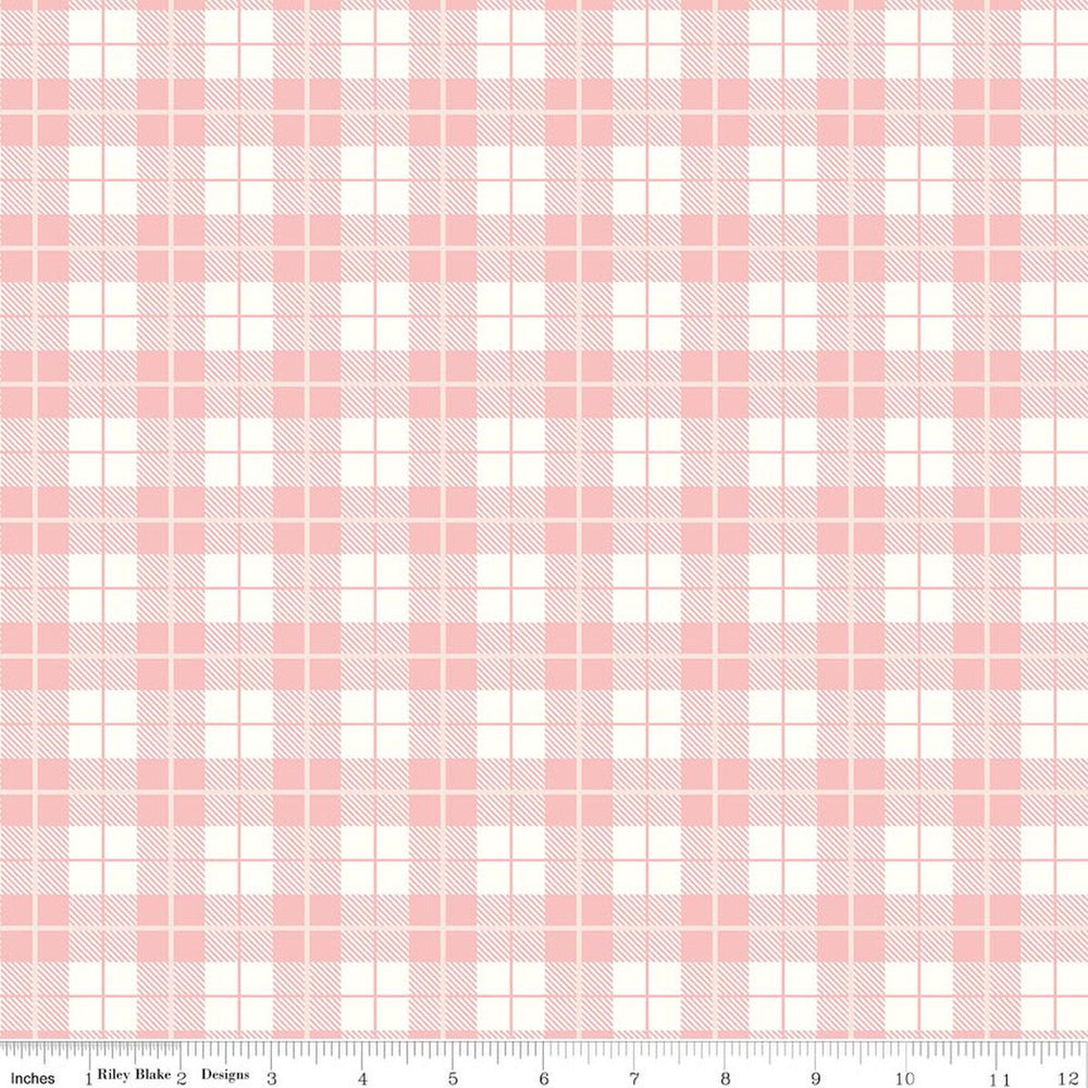 Pink and white plaid fabric pattern with a ruler at the bottom