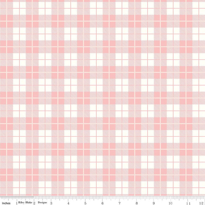 Pink and white plaid fabric pattern with a ruler at the bottom