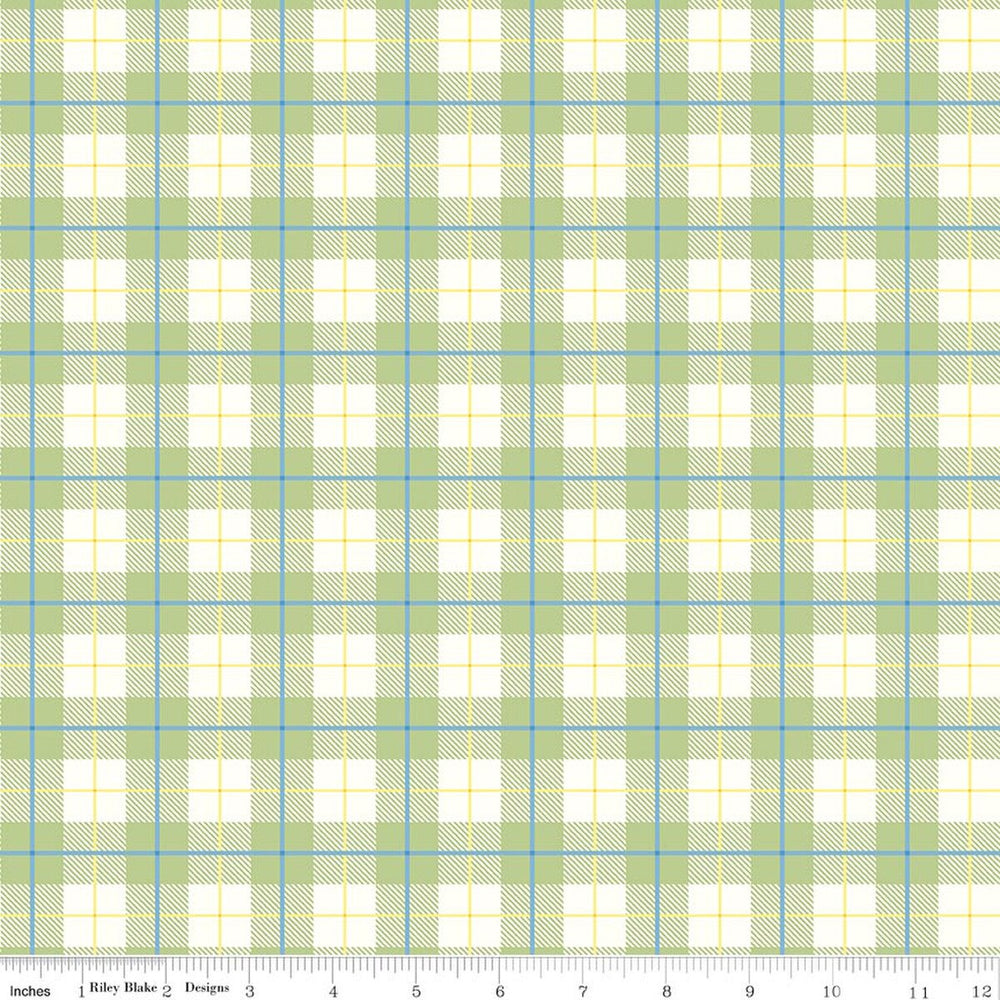 Plaid fabric pattern with green, blue, and white colors on a white background.