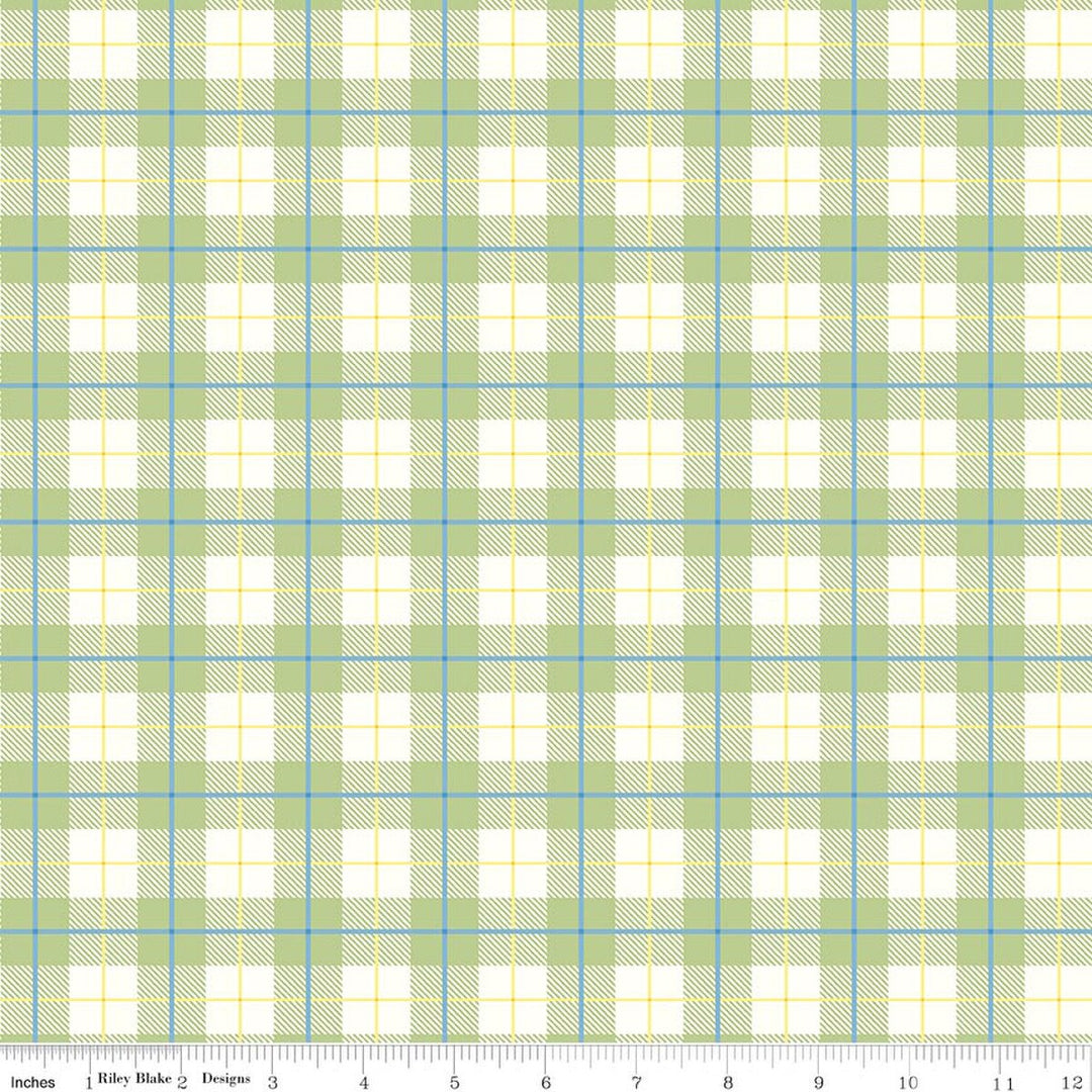 Plaid fabric pattern with green, blue, and white colors on a white background.