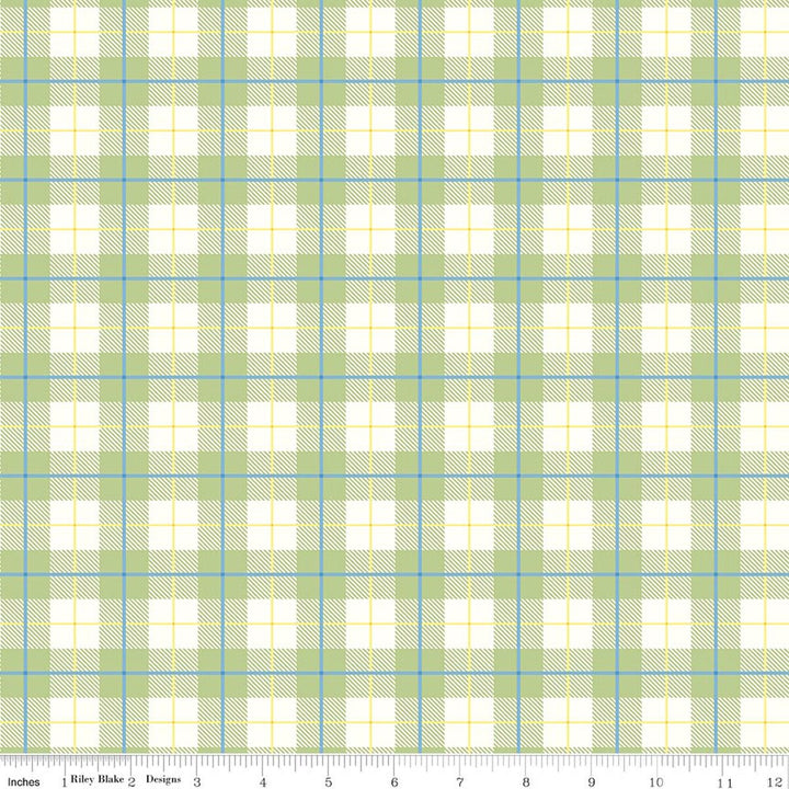 Plaid fabric pattern with green, blue, and white colors on a white background.