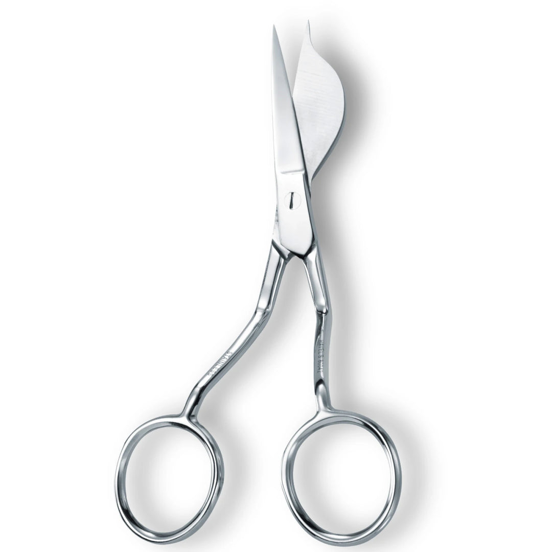 Pair of silver scissors on a white background