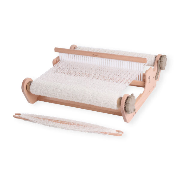 Wooden pet grooming table with white cushion on a white background
