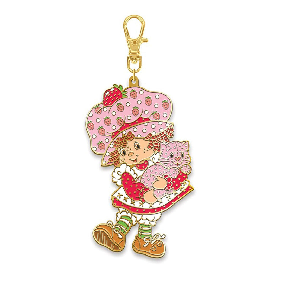 Keychain with cartoon character holding a cat on a white background