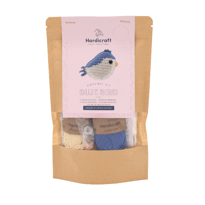 Knitting kit for a blue bird with packaging on a white background