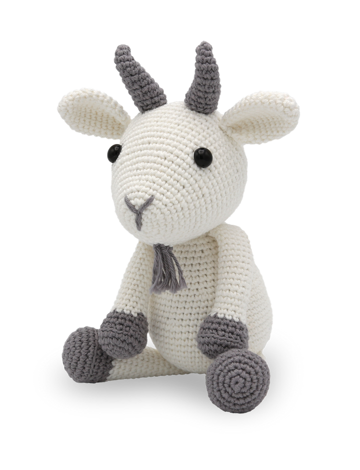 Crocheted toy goat with gray horns and feet on a white background