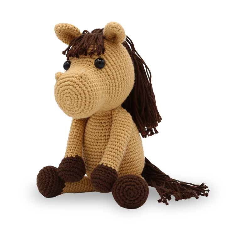 Crocheted horse toy with brown mane and legs on a white background