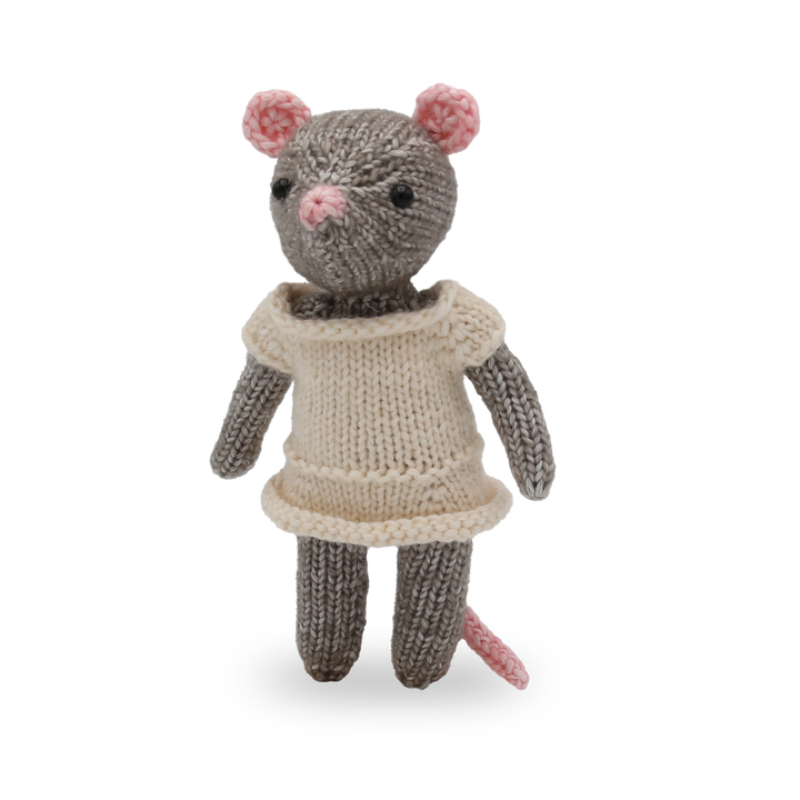 Knitted mouse toy wearing a beige dress on a white background