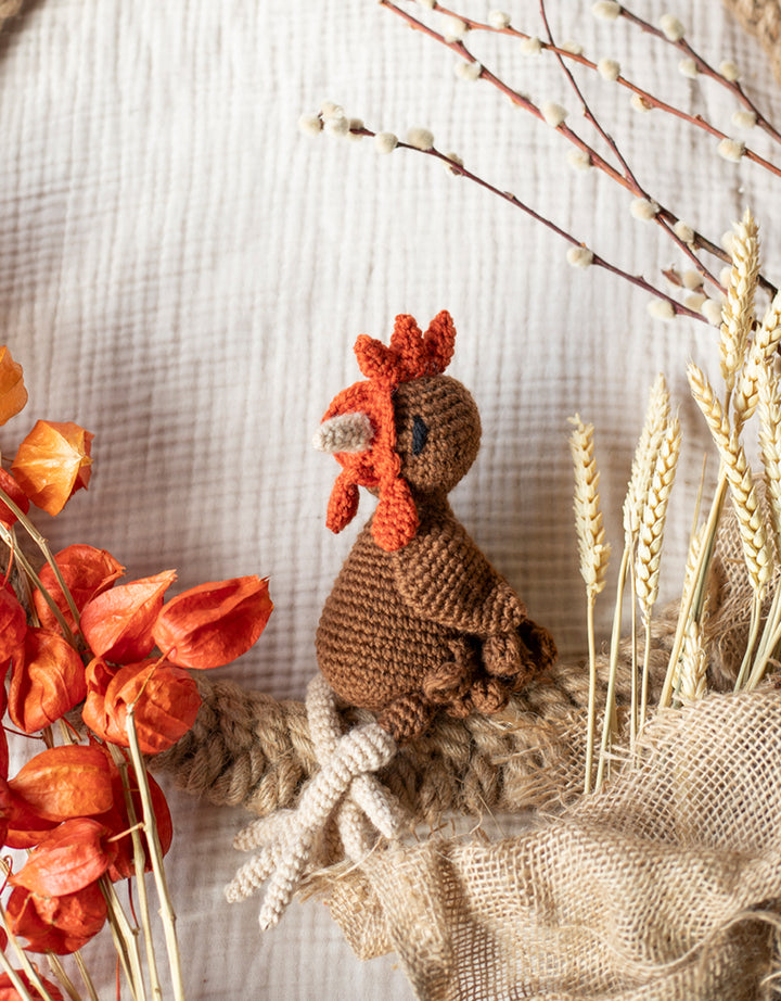 completed Hazel the Hen product posed with wheat and flowers and burlap