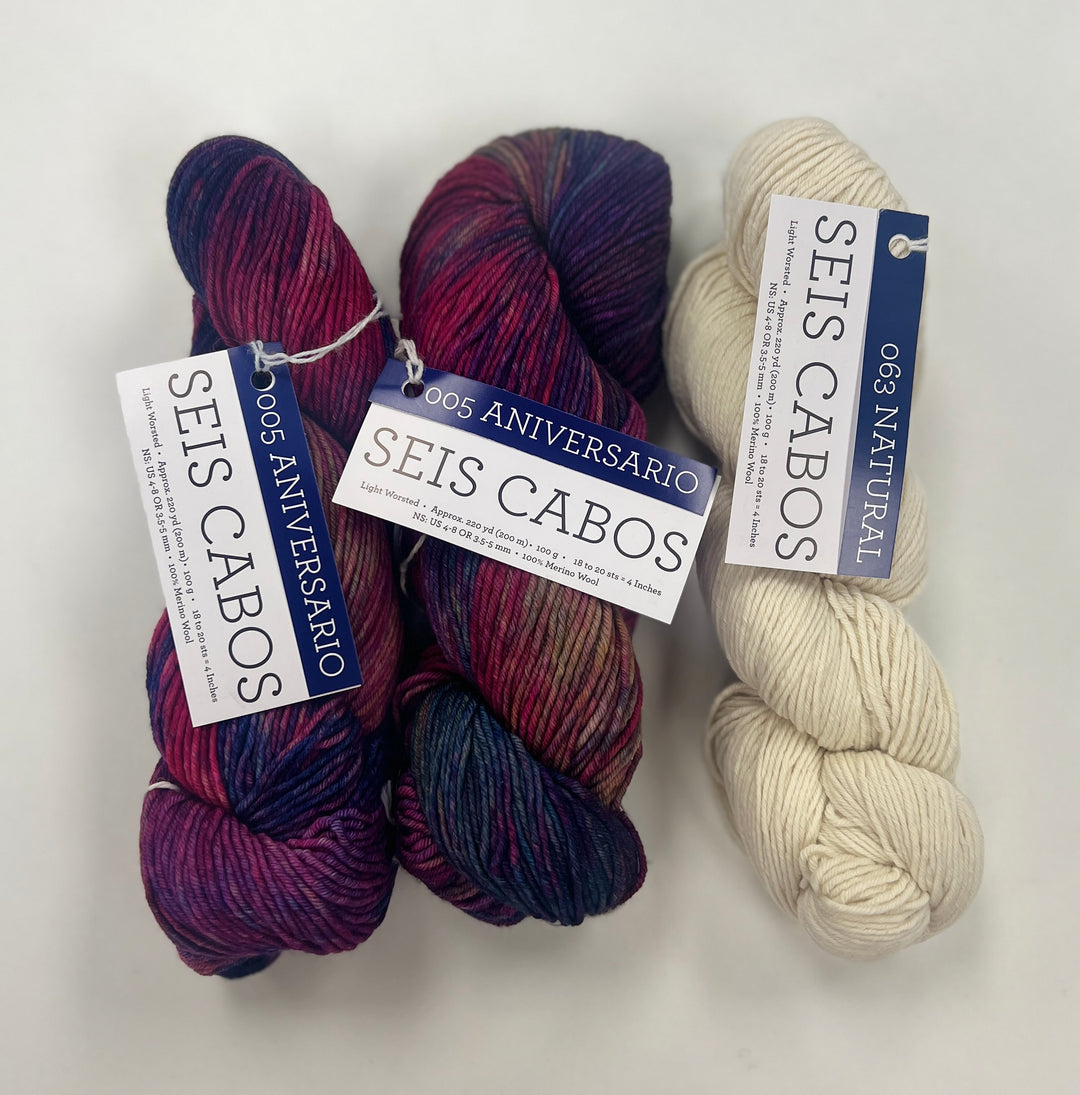 Three skeins of yarn with 'Seis Cabos' labels on a white background