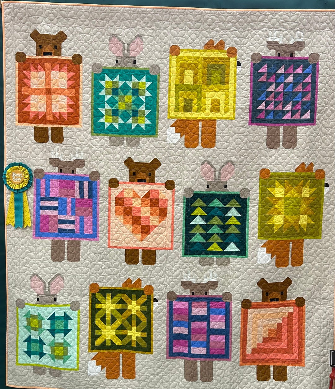 Quilt with animal-themed blocks featuring various quilt patterns