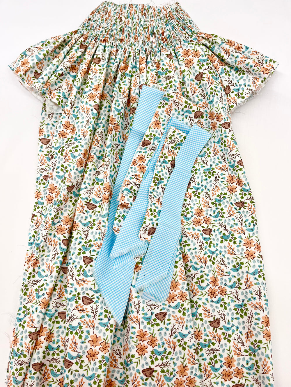 pleated bishop in terra cotta and teal floral with teal turquoise gingham on top