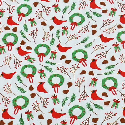cardinals wreaths and pinecones on a light blue background
