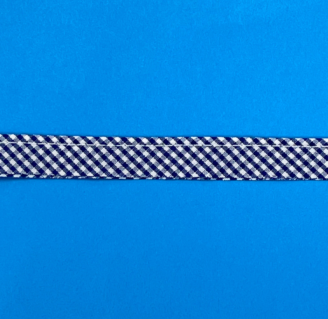 Navy and white checkered ribbon on a blue background