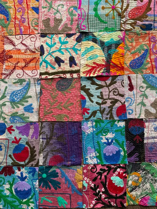 Colorful patchwork quilt with intricate patterns