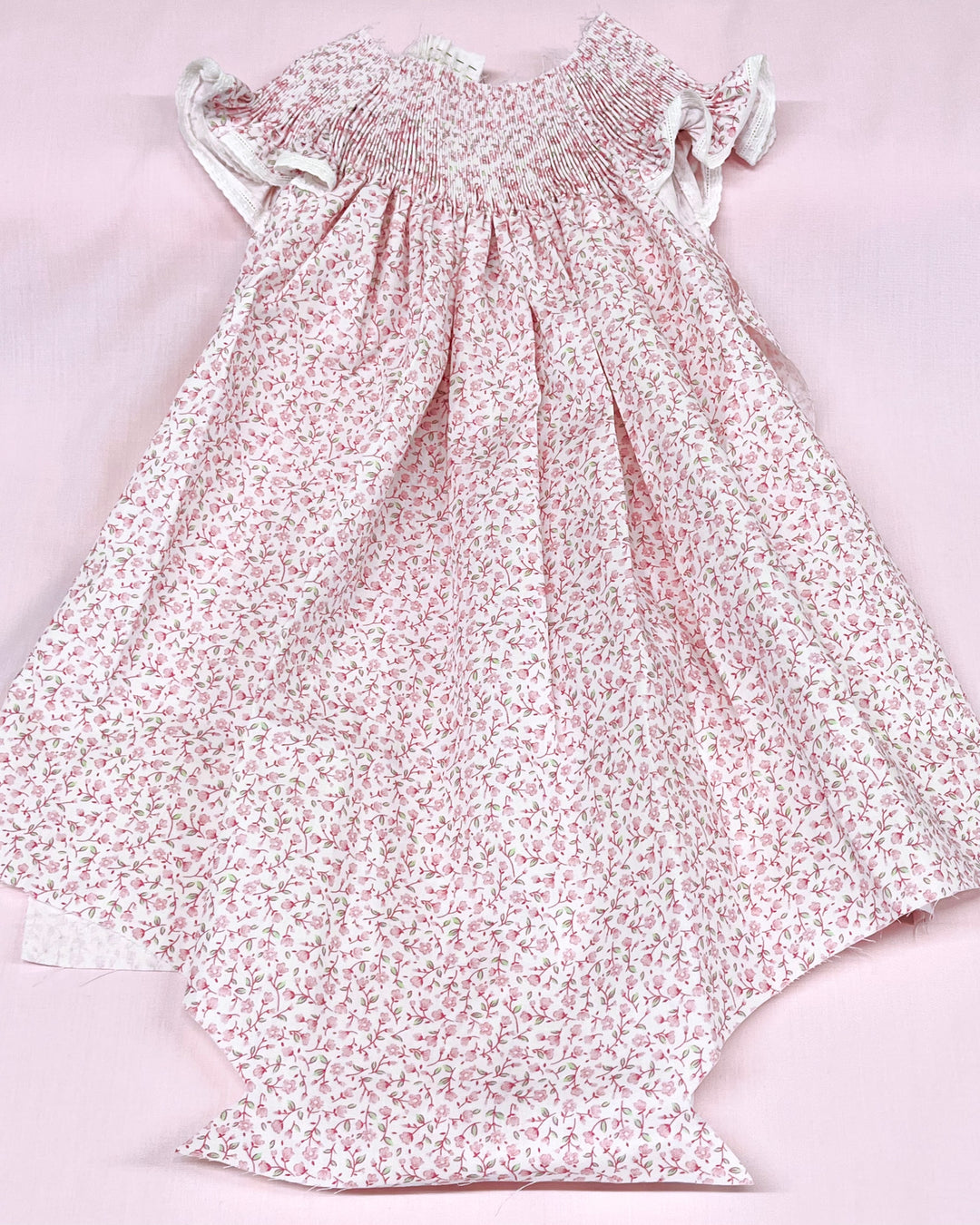 Floral dress on a light pink background