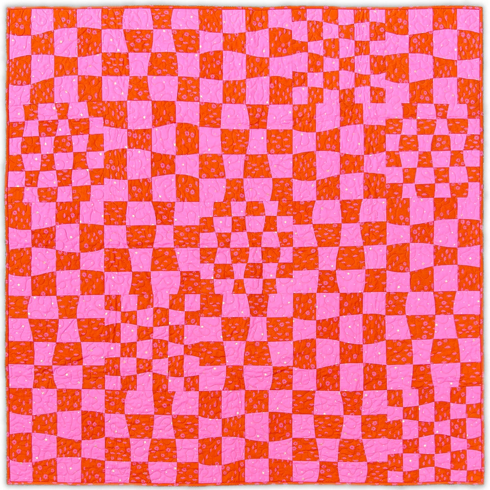 wavy checkered patchwork quilt in bright pink and red colors