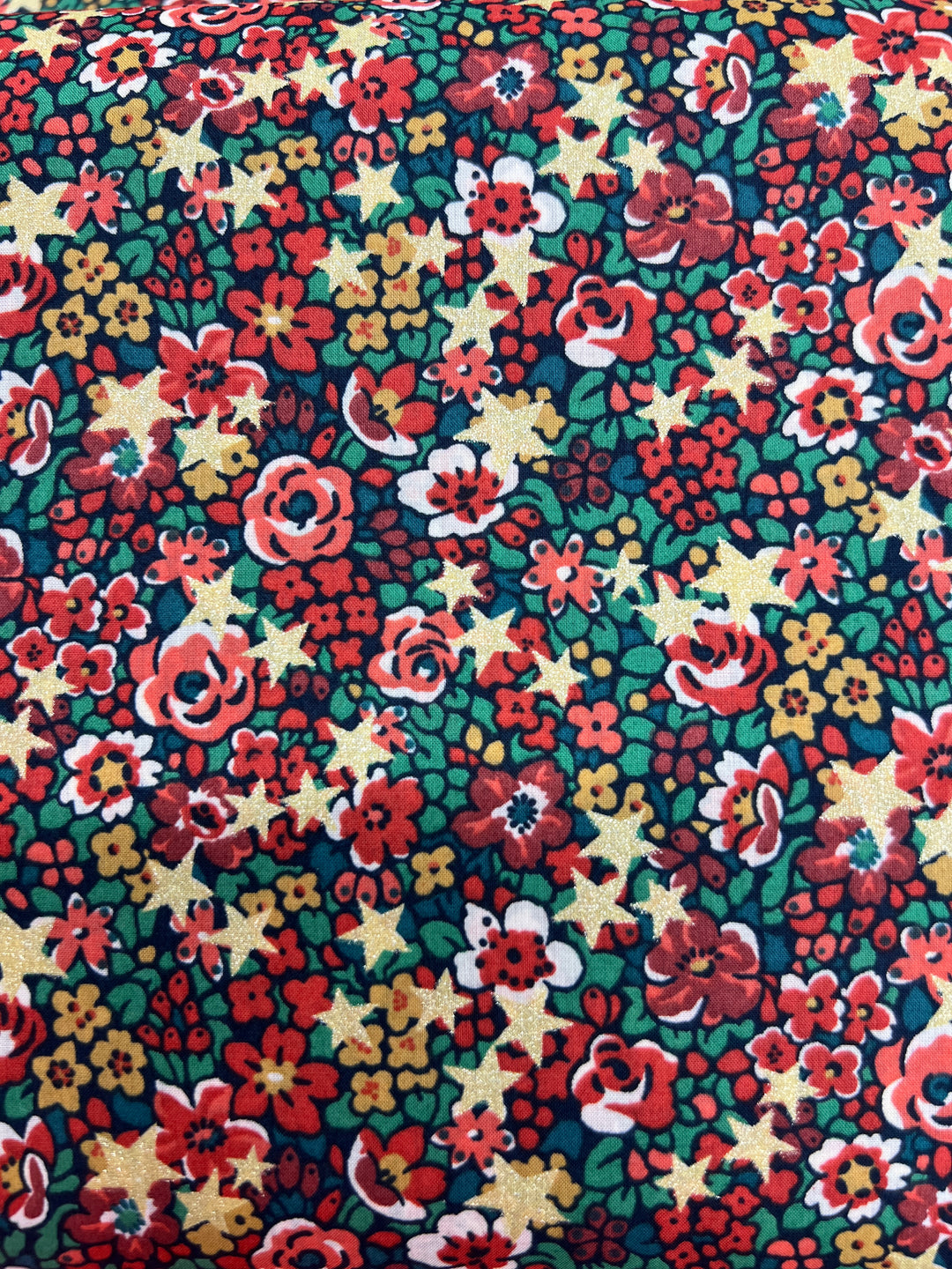 Liberty of London fabric with red flowers and gold metallic stars