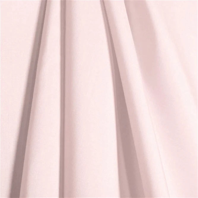 a drape of soft pink fabric 