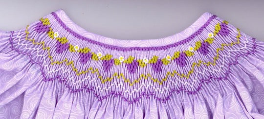 Smocking plate with bunches of grapes on a vine. 6 rows of smocking on a bishop.
