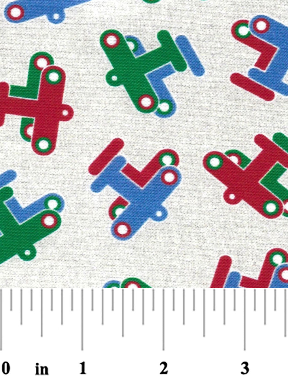 fabric swatch with red, green, and blue planes on a beige background with a ruler at the bottom for scale.