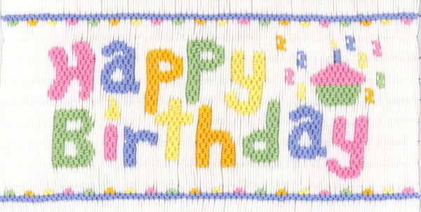 Smocking plate with the words "Happy Birthday" and a cupcake. 9 1/2 rows of smocking on a yoke.
