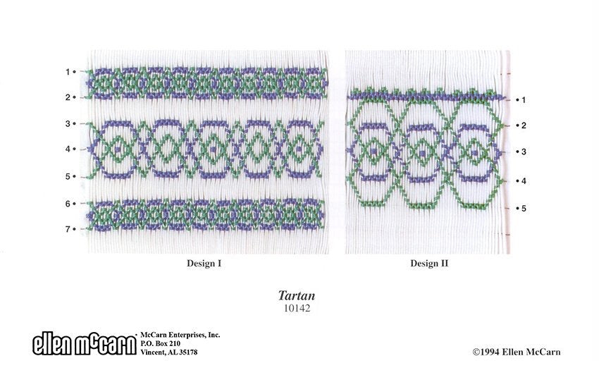 geometric smocking design in blue and green on white pleated fabric