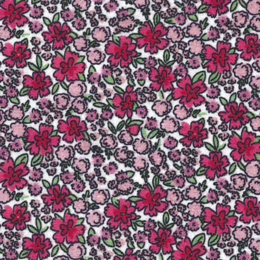A close-up of a floral fabric pattern featuring pink and magenta flowers with green leaves on a white background.