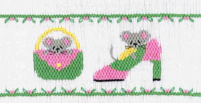 Smocking plate with two mice hiding behind a purse and a shoe. 8 1/4 rows of smocking on a yoke.