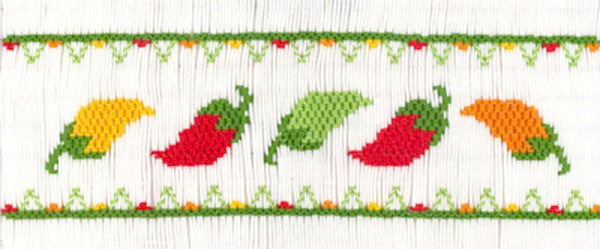 Smocking plate with five hot chili peppers. 7 rows of smocking on a yoke.