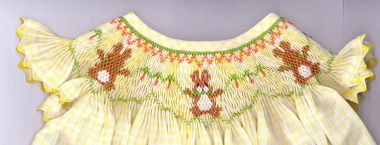 Smocking plate with rabbits and carrots. 7 rows of smocking on a bishop.