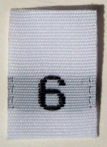 White woven label with the number 6 on a gray background