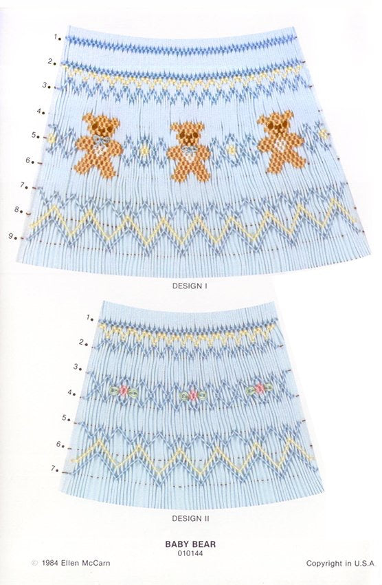 Smocking plate with a two variations of geometric design smocked on blue pleated fabric in brown, tan, and ecru with either baby bears or flowers. 7-9 rows of smocking on a bishop.