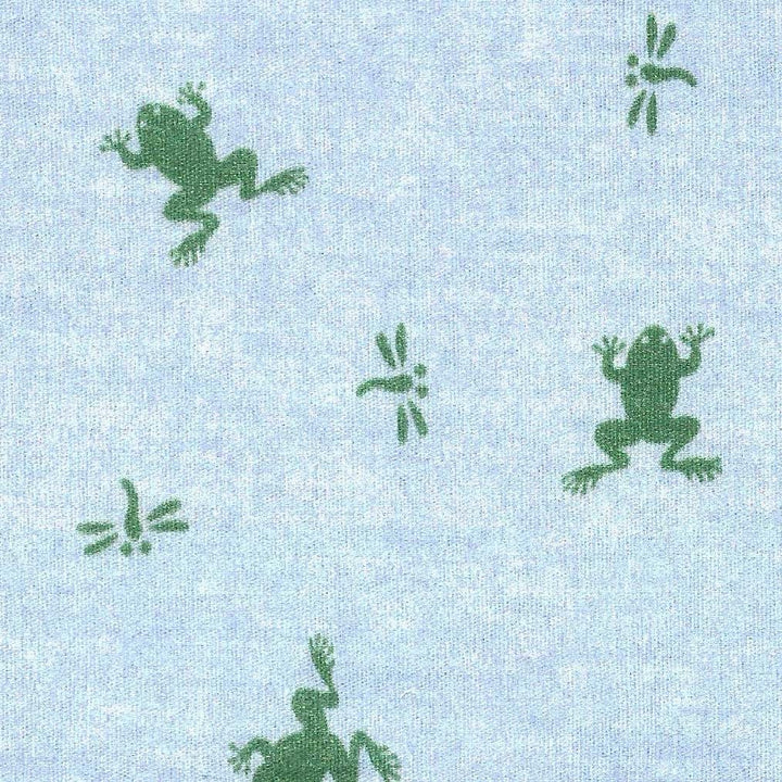 Green frog silhouettes on a light blue fabric background