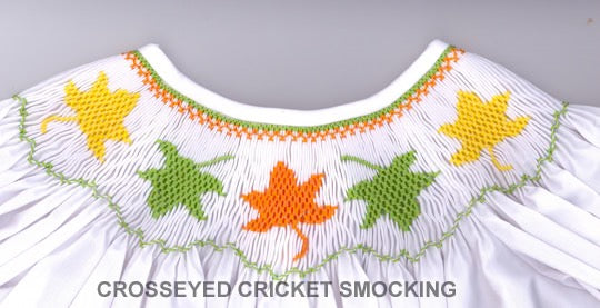 Smocking plate with fall leaves. 7.5 rows of smocking on a bishop.