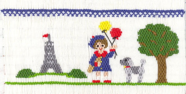 Smocking plate with a park scene in Paris with a lady holding balloons and a poodle with the Eiffel Tower in the distance. 9 rows of smocking on a yoke.