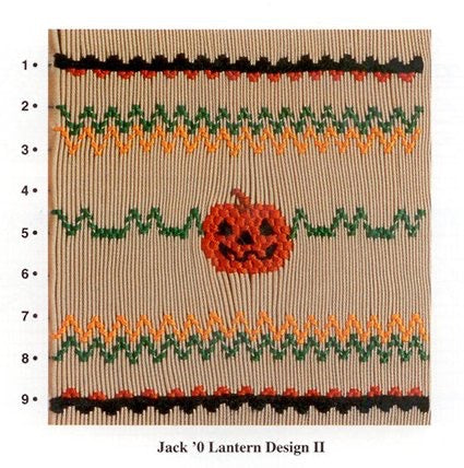 Smocking design for a Jack 'O Lantern design on beige fabric.
