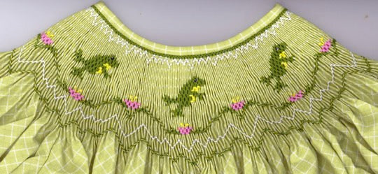 Smocking plate with leaping frogs and a geometric design. 8 1/2 rows of smocking on a bishop.