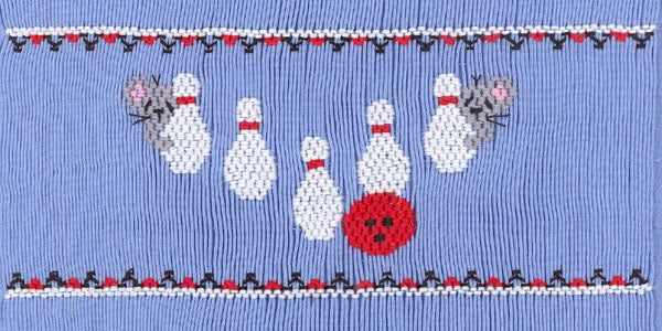 Smocking plate with two mice next to a bowling ball and pins. 9 rows of smocking on a yoke.
