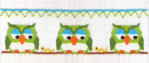 Smocking plate with three owls. 7 rows of smocking on a yoke.