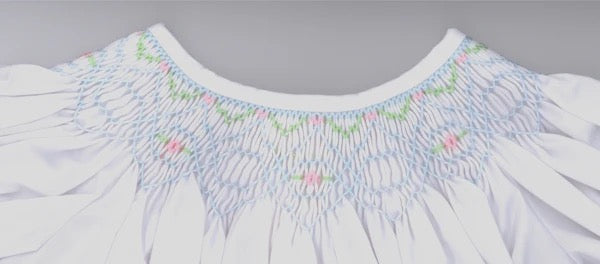 Smocking plate with sweet geometric design. 5.5 rows of smocking on a bishop.