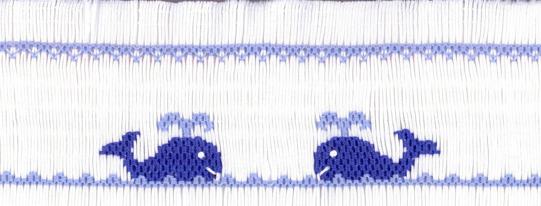 blue whale designs on a white background