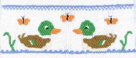Smocking plate with two ducks in water. 8 rows of smocking on a yoke.