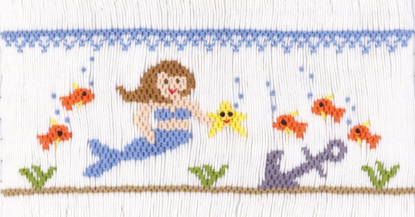 Smocking plate with a mermaid, fish, a starfish and an anchor. 8 1/2 rows of smocking on a yoke.