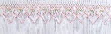 Smocking design on a white pleated insert