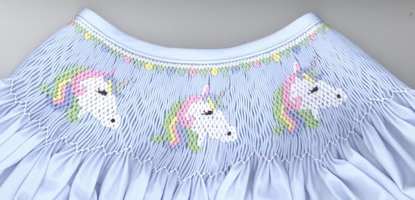 Smocking plate with unicorn. 7 rows of smocking on a yoke.