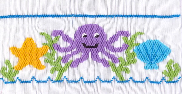 Smocking plate with an octopus, a shell and a starfish. 8 1/2 rows of smocking on a yoke.